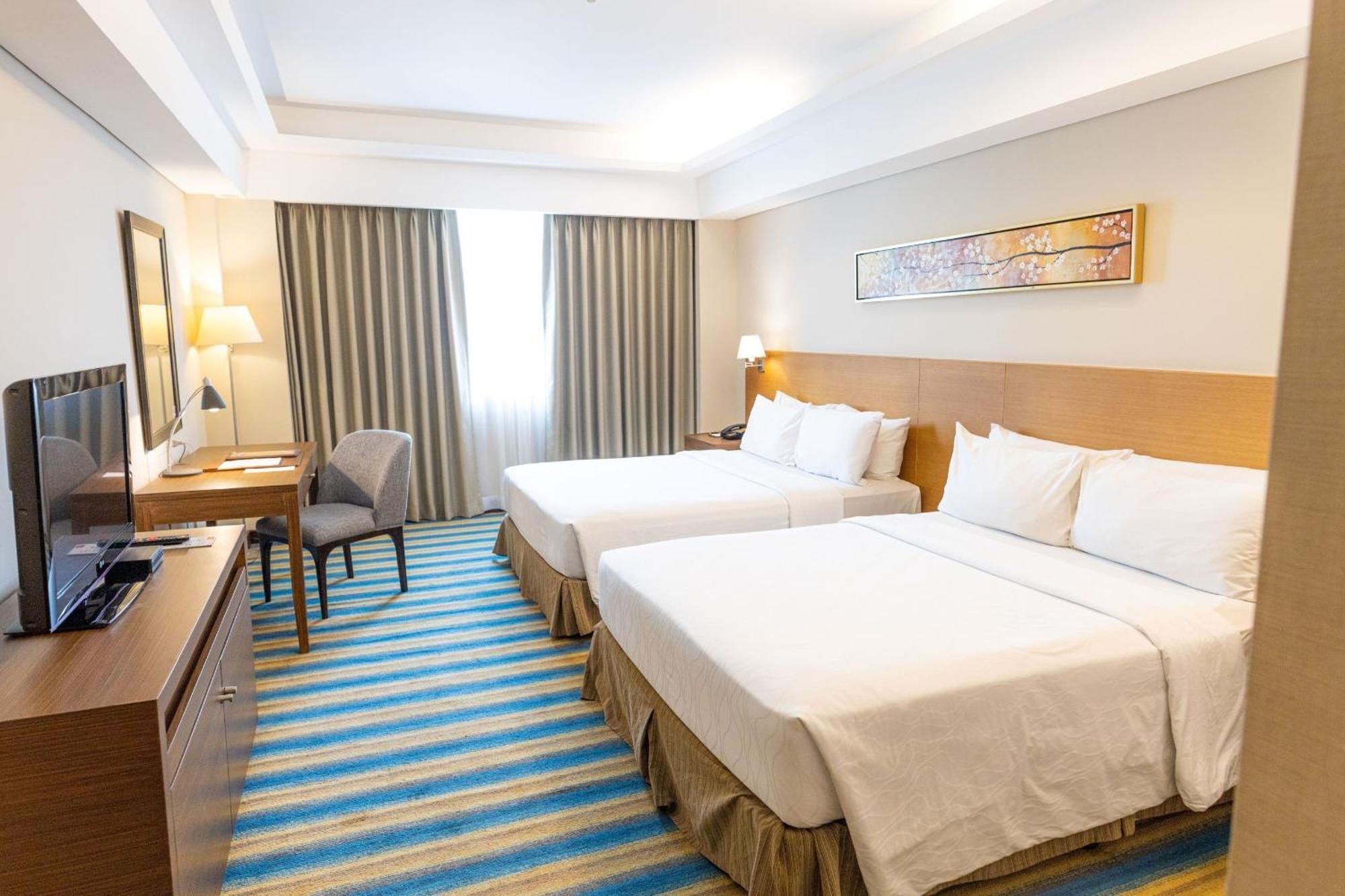 קואזון סיטי Luxent Hotel מראה חיצוני תמונה