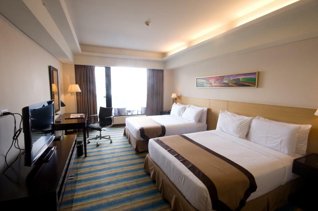 קואזון סיטי Luxent Hotel מראה חיצוני תמונה